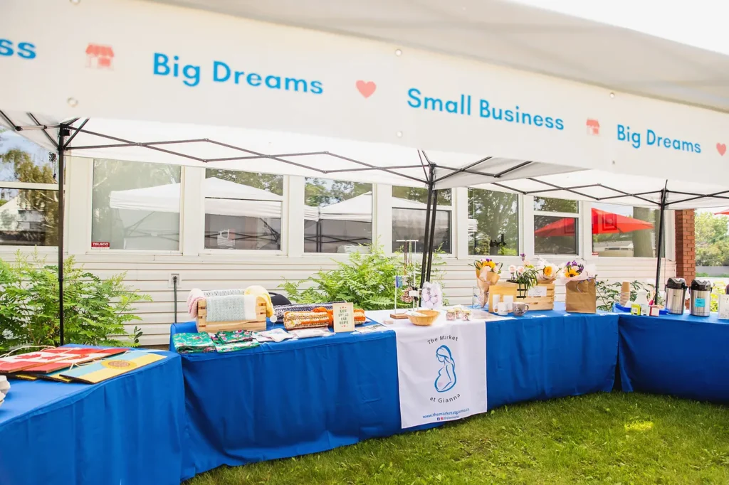 The Market at Gianna stall under a Big Dreams, Small Business canopy